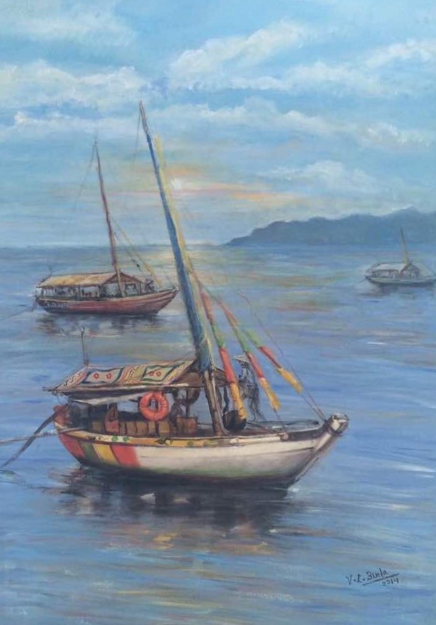 Three fishing boats resting on calm blue water beneath a soft sky