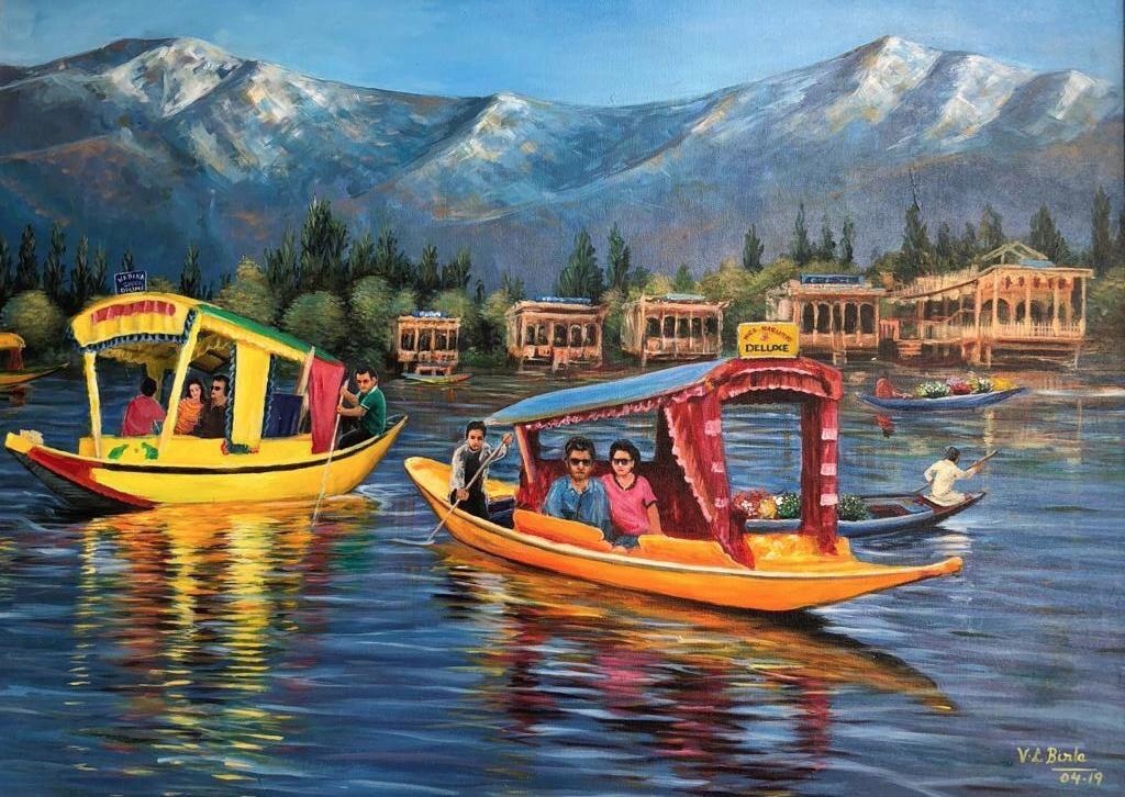 Colourful shikaras crossing Dal Lake beneath mountain peaks