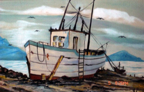 Fishing ship drawn up near a rocky shore under a cloudy sky
